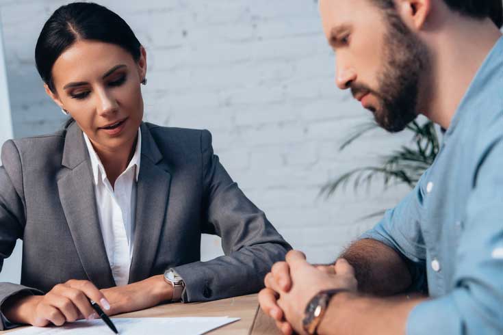 lawyer and client discussing about Denied life insurance claims