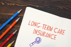 Conceptual photo about Long-Term Care Insurance with handwritten text.